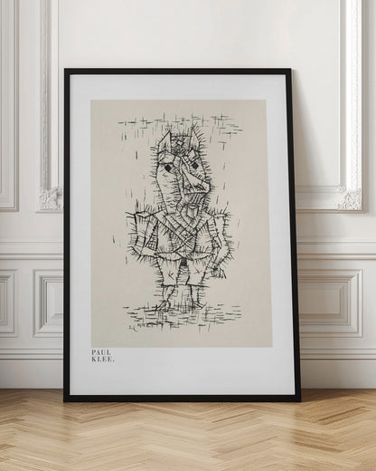 A framed art print of a Paul Klee drawing. The artwork features a stylized, abstract figure composed of short, spiky black ink lines on a light cream background, giving it a prickly texture. The figure stands against a sparse background with simple lines. The print is in a black frame, and the text 'PAUL KLEE.' is visible in the lower-left corner. Decor