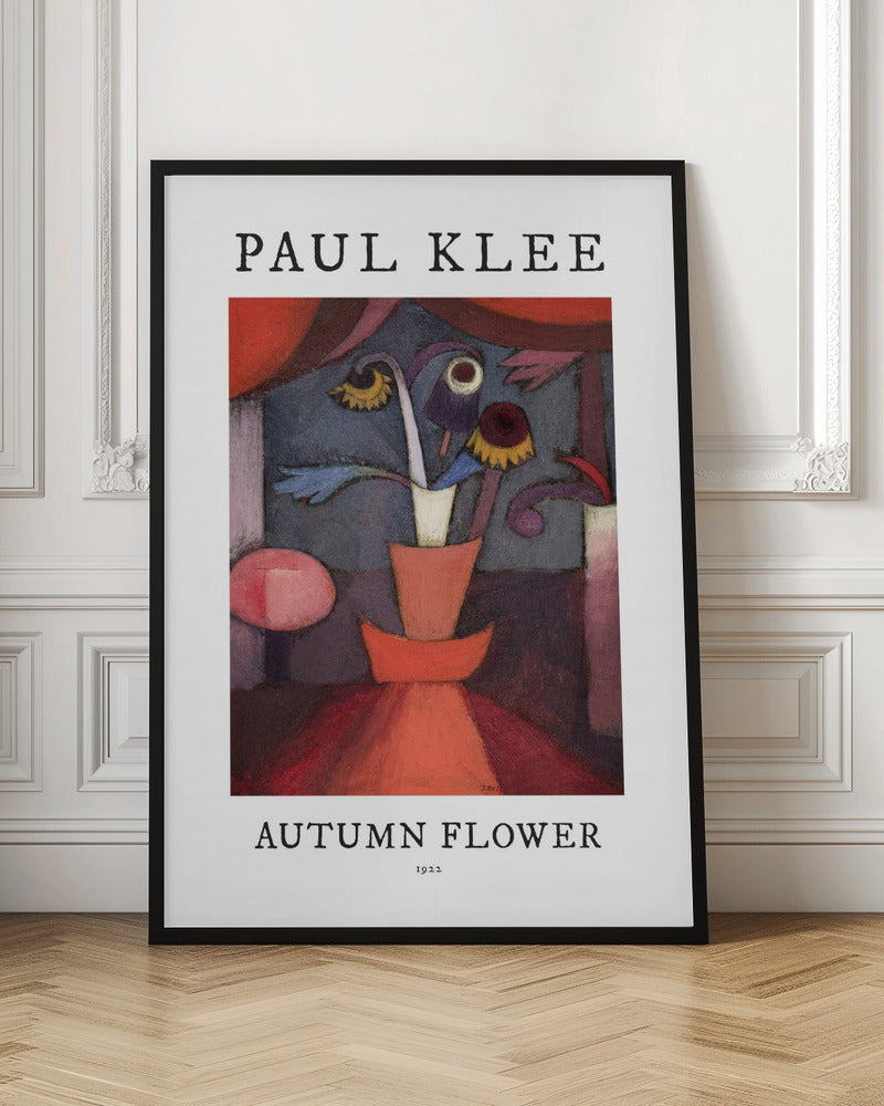 A poster of Paul Klee's 1922 painting 'Autumn Flower'. The abstract artwork features a stylized vase with surreal flowers in shades of red, orange, blue, and purple. The poster has a white border with 'PAUL KLEE' at the top and 'AUTUMN FLOWER 1922' at the bottom, all within a thin black frame. Poster