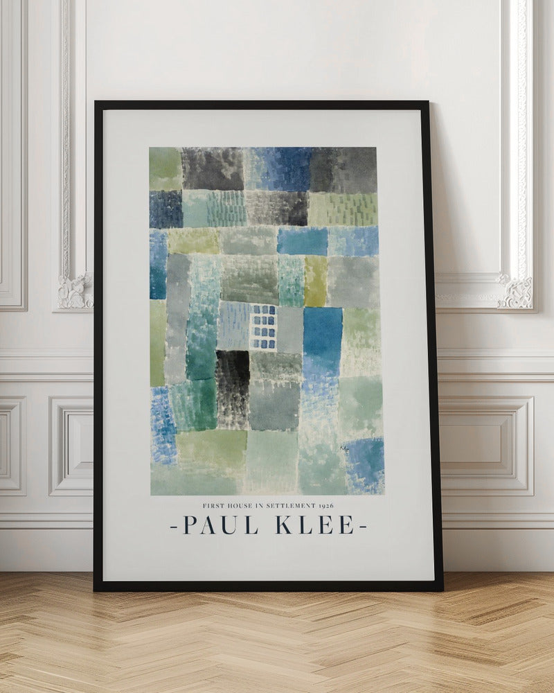 A framed art print of Paul Klee's 1926 painting 'First House in Settlement.' The artwork is an abstract composition of rectangular watercolor blocks in muted shades of blue, green, and grey, arranged in a grid pattern. The title and artist's name are printed below the image. Decor