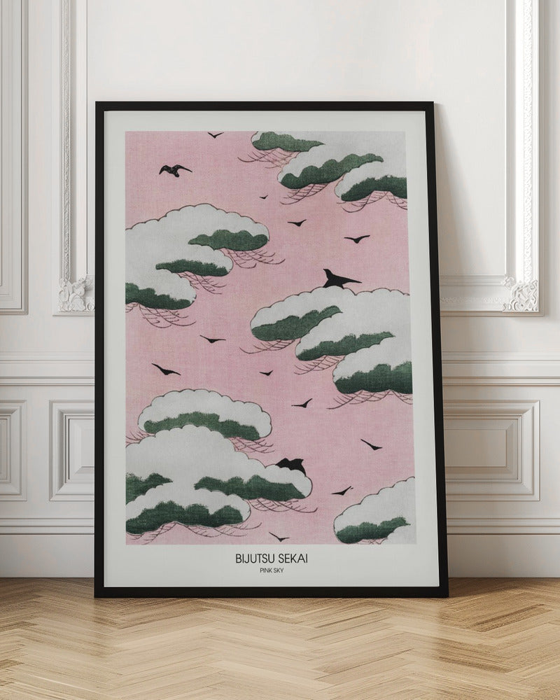 A framed Japanese art print titled 'Bijutsu Sekai Pink Sky' depicting stylized, snow-capped green and white clouds floating in a soft pink sky, with black birds flying between them. Print