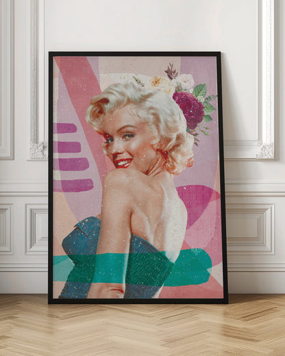 A framed, collage-style portrait of Marilyn Monroe smiling over her shoulder. Her classic blonde hair is adorned with pink, white, and burgundy flowers. She wears bright red lipstick and a blue strapless dress. The background is a textured composition of abstract shapes in shades of pink, purple, and beige, with modern teal and purple brushstrokes layered across the image. Decor
