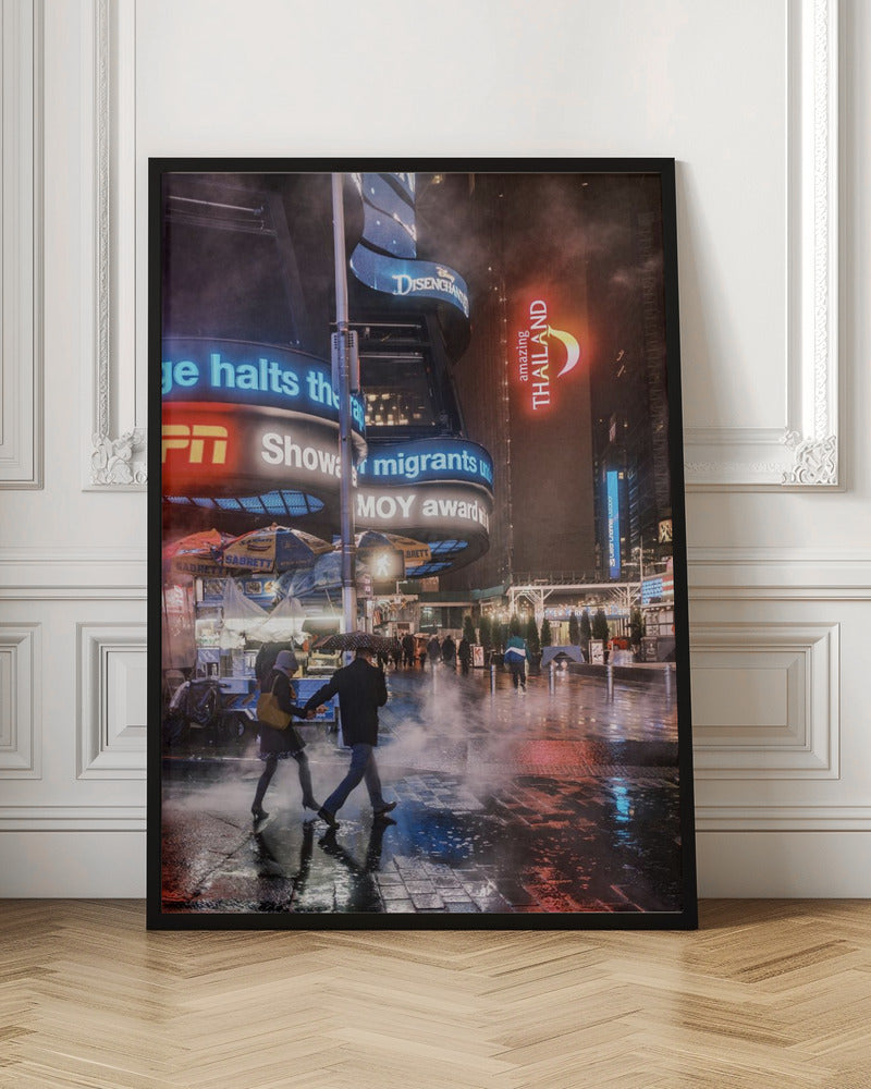 A couple walks hand-in-hand under an umbrella on a rainy night in a bustling city square. Steam rises from the wet pavement, which reflects the vibrant blue, red, and white lights from massive digital billboards on the surrounding buildings. Wall Art
