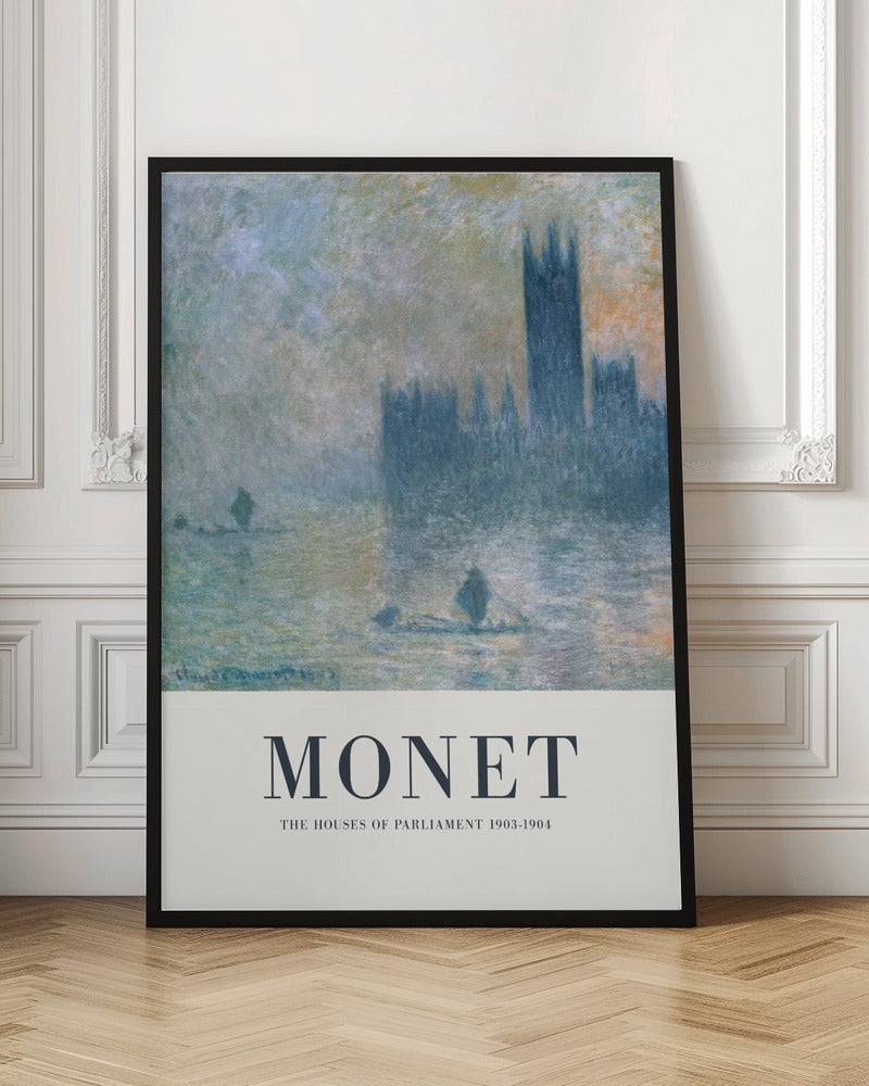 A framed art poster of Claude Monet's impressionist painting, 'The Houses of Parliament'. The painting shows the silhouette of the building through a dense fog over the River Thames, rendered in soft blues, greys, and muted oranges. The artwork is set above a wide, off-white border with the text 'MONET' and 'THE HOUSES OF PARLIAMENT 1903-1904'. Poster