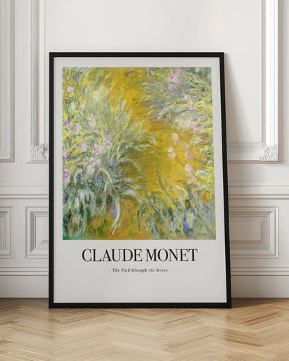 A framed art print of Claude Monet's impressionist painting, 'The Path Through the Irises'. The artwork features a vibrant garden scene with lush green foliage and pink flowers against a golden-yellow background. Below the painting, the text 'CLAUDE MONET - The Path Through the Irises -' is displayed on a white mat. Artwork