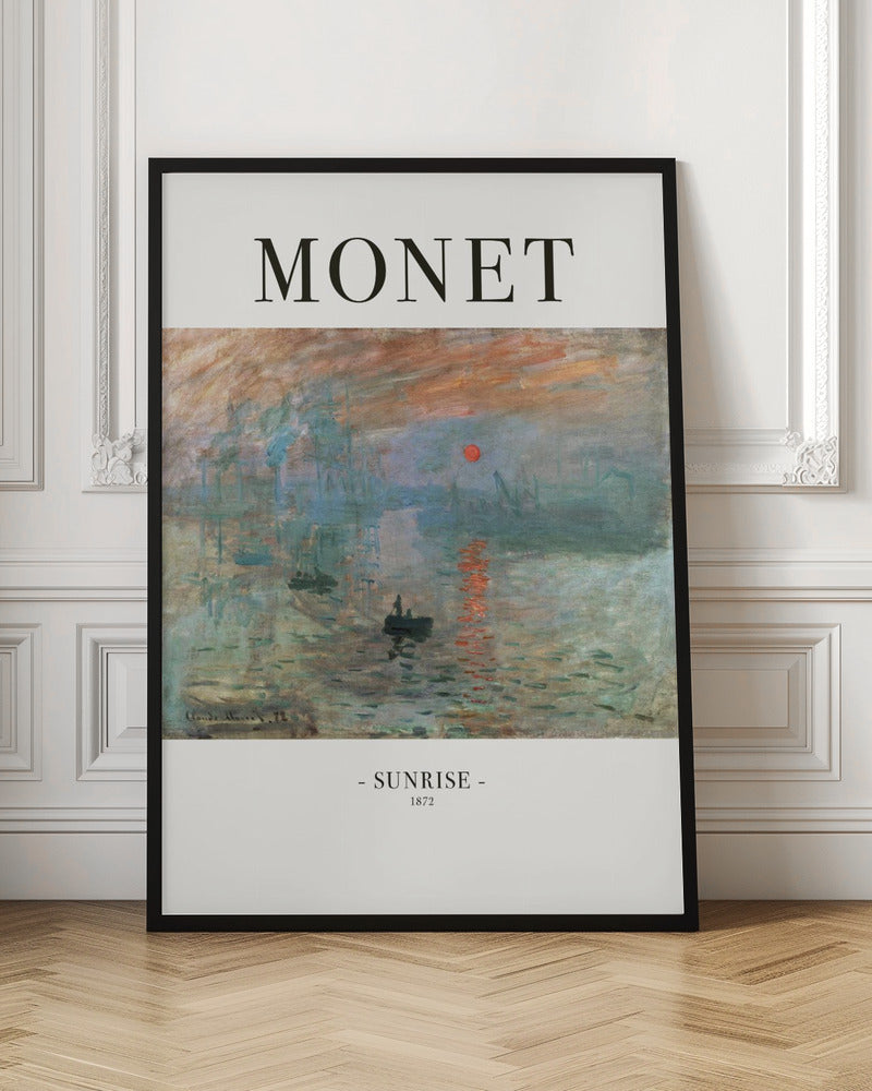 A framed art poster of Claude Monet's famous painting, 'Impression, Sunrise'. The top of the poster reads 'MONET' and the bottom reads '- SUNRISE - 1872'. The impressionist painting shows a hazy sunrise over a harbor, with a bright orange sun reflecting on the blue-grey water and small boats silhouetted in the foreground. Poster