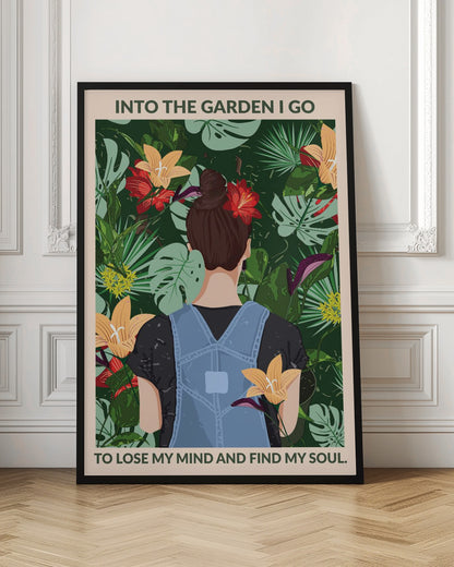 A poster featuring an illustration of a woman with her back to the viewer, wearing blue overalls and a red flower in her brown bun. She is standing amidst a lush, tropical garden filled with green leaves and colorful flowers. The text above and below her reads, 'Into the garden I go to lose my mind and find my soul.' Poster