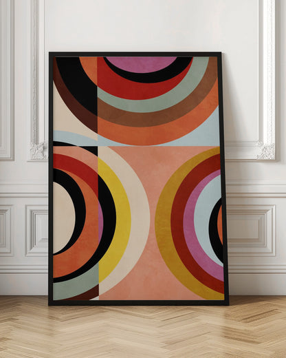 An abstract geometric artwork in a black frame, divided into quadrants. It features large, colorful concentric arcs in shades of orange, red, black, brown, and yellow, creating a dynamic and retro composition against a textured peach and off-white background. Artwork