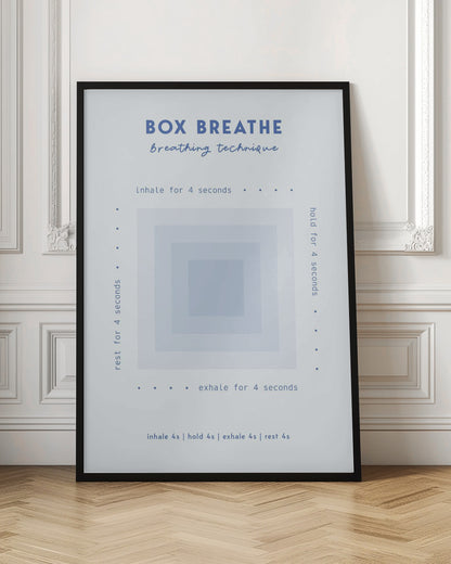 A framed minimalist poster explaining the 'Box Breathe' technique. A central graphic of concentric light blue squares is surrounded by instructions: 'inhale for 4 seconds,' 'hold for 4 seconds,' 'exhale for 4 seconds,' and 'rest for 4 seconds,' guiding a calming breathing exercise. Print