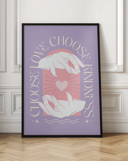 An inspirational art print with a lavender background featuring two hands cupping a glowing pink heart. The text 'Choose Love' and 'Choose Kindness' curves around the central image in a cream-colored font. Decor