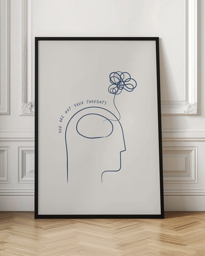 A minimalist blue line drawing on a cream background depicting a human head in profile with the text 'YOU ARE NOT YOUR THOUGHTS' curving above it. A tangled scribble floats out of the head, symbolizing the detachment from one's thoughts. The art is presented in a black frame. Poster