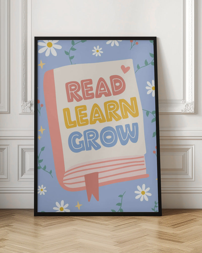 A cheerful illustration of an open book with the words 'READ LEARN GROW' written in colorful, playful letters. The background is light blue with white daisies, green vines, and yellow sparkles, creating a positive and educational theme. Poster
