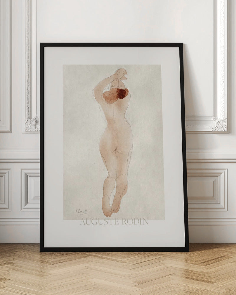 A vintage art print by Auguste Rodin featuring a watercolor and pencil sketch of a nude woman from behind. She has reddish-brown hair and her arms are raised above her head. The piece is set against an off-white background and enclosed in a black frame. Artwork