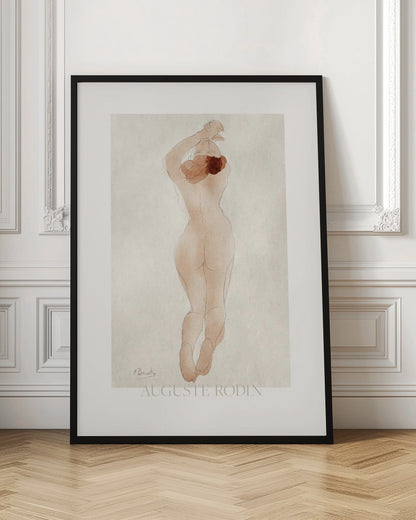 A vintage art print by Auguste Rodin featuring a watercolor and pencil sketch of a nude woman from behind. She has reddish-brown hair and her arms are raised above her head. The piece is set against an off-white background and enclosed in a black frame. Artwork