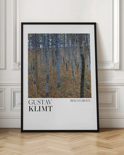 A framed art print of Gustav Klimt's painting 'Beech Grove.' The artwork showcases a dense forest of slender tree trunks in varying shades of blue, grey, and brown, standing on a thick carpet of fallen autumn leaves in orange and brown hues. Below the painting, on a white border, the text reads 'GUSTAV KLIMT' on the left and 'BEECH GROVE.' on the right. Poster