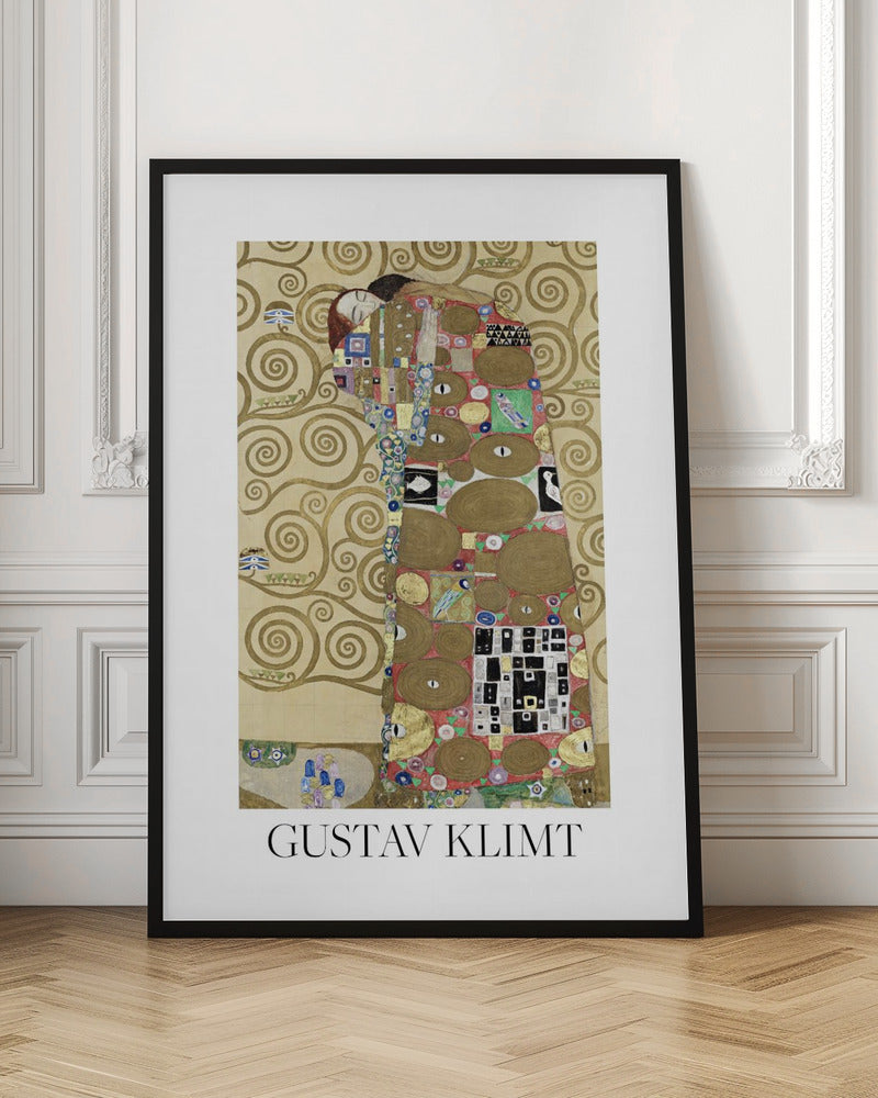 A framed art print of Gustav Klimt's painting 'Fulfillment,' featuring a stylized couple embracing. They are enveloped in ornate, patterned robes with geometric and circular motifs, set against a golden background with swirling patterns. The artist's name, 'GUSTAV KLIMT,' is printed below the image. Wall Art