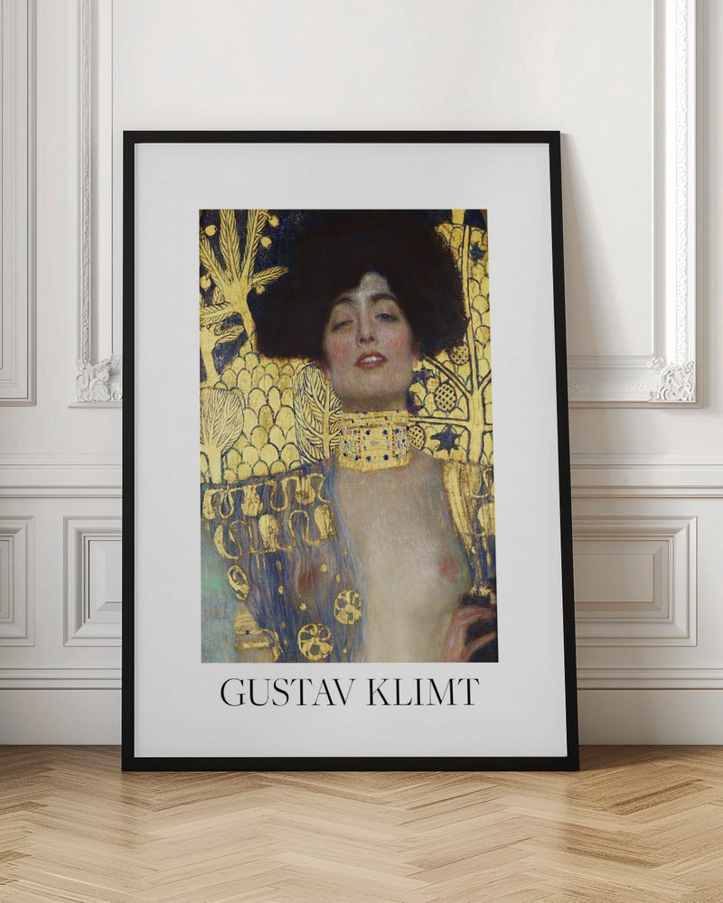 A fine art poster of Gustav Klimt's painting 'Judith and the Head of Holofernes'. The artwork depicts a woman with dark, styled hair and a sensual expression, wearing a large, ornate gold choker. Her body is partially draped in a blue and gold patterned garment, against a richly decorated gold leaf background. The poster is presented in a black frame with a white border, and the artist's name is printed at the bottom. Wall Art