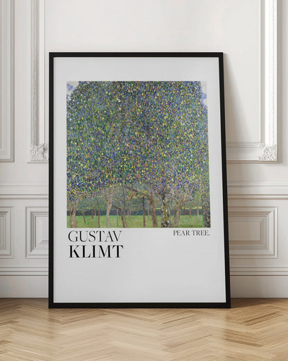 A framed art print of Gustav Klimt's 'Pear Tree.' The painting features a dense canopy of a pear tree, rendered in a pointillist style with a mosaic of green, blue, and yellow dots. Below the main tree, a grassy orchard with more tree trunks is visible. The artwork is set on a white background with 'GUSTAV KLIMT' printed in large black letters on the left and 'PEAR TREE.' on the right. Artwork