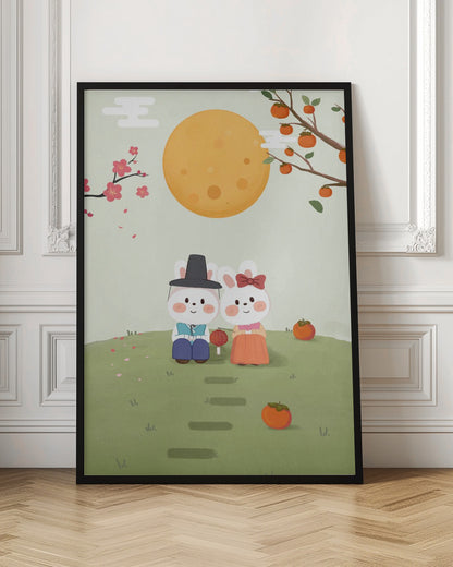 A cute illustration of two rabbits in traditional Korean hanbok sitting on a grassy hill under a large orange full moon. A male rabbit in a blue outfit and black hat sits next to a female rabbit in an orange dress with a red bow. They are surrounded by persimmons and cherry blossoms, creating a peaceful, festive scene. Print