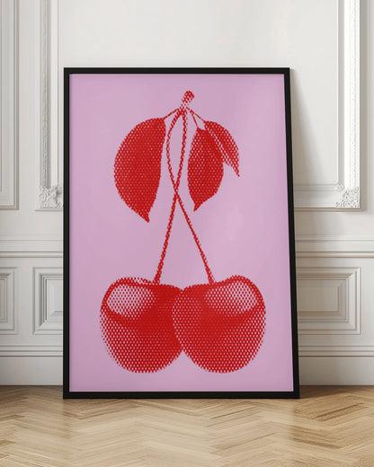A pop art style print of two bright red cherries with stems and leaves, rendered in a halftone dot pattern against a solid light pink background, enclosed in a simple black frame. Wall Art