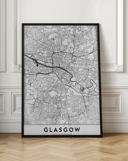 A minimalist black and white art print of a Glasgow city map, featuring a detailed network of streets and the River Clyde, all enclosed in a simple black frame. The city name 'GLASGOW' is displayed in bold at the bottom. Wall Art