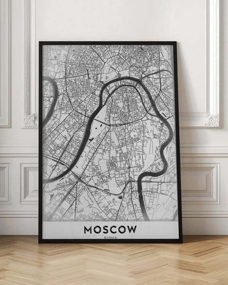 A framed, minimalist black and white street map of Moscow, Russia. The map details the intricate road network and the winding Moskva River. The word 'MOSCOW' is printed in large, black capital letters at the bottom. Print