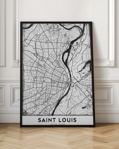A framed, black and white artistic map of Saint Louis. The map displays a detailed grid of city streets and a prominent, winding river in a stylized, modern design with a slightly distressed texture. The city's name, 'SAINT LOUIS', is printed in a bold, sans-serif font at the bottom. Wall Art