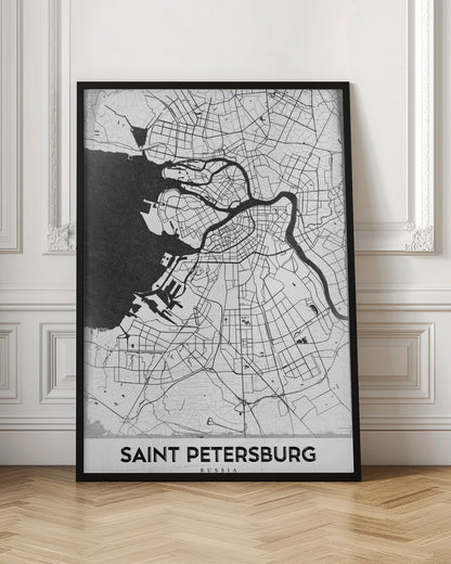 A minimalist black and white framed map of Saint Petersburg. The design features a white landmass with black lines for roads and rivers, contrasting with the solid black sea. The text 'SAINT PETERSBURG' is displayed in a bold, sans-serif font at the bottom of the map. Print