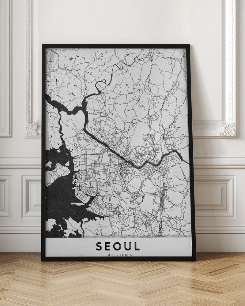 A minimalist black and white map of Seoul, South Korea, showing the city's intricate network of roads and the Han River. The map is presented in a modern, artistic style with a simple black frame and the word 'SEOUL' in bold capital letters at the bottom. Decor