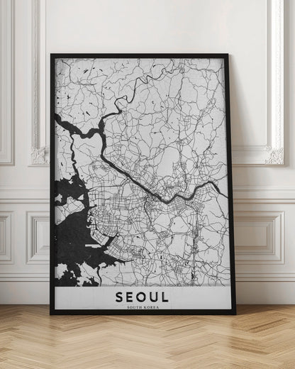 A minimalist black and white map of Seoul, South Korea, showing the city's intricate network of roads and the Han River. The map is presented in a modern, artistic style with a simple black frame and the word 'SEOUL' in bold capital letters at the bottom. Decor