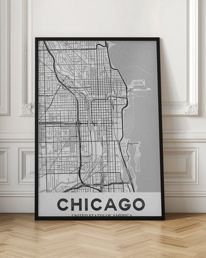 A minimalist black and white map of Chicago, presented vertically. The map shows the city's grid system, highways, and waterways, with Lake Michigan to the right. The word 'CHICAGO' is in a bold, sans-serif font at the bottom, all enclosed within a thin black frame. Poster