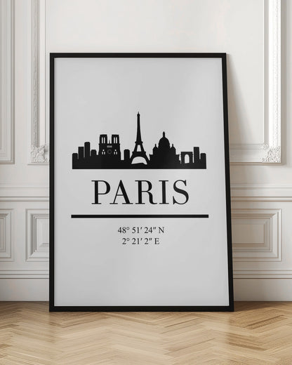 A minimalist black and white poster in a black frame. It features a black silhouette of the Paris skyline, including the Eiffel Tower and Notre Dame. Below the city is the word 'PARIS' in a large serif font, followed by its geographical coordinates. Poster