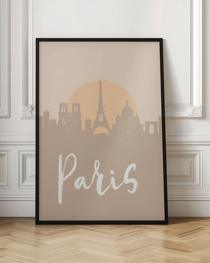 A minimalist art print of the Paris skyline in muted tan and beige tones. Silhouettes of the Eiffel Tower and other landmarks stand before a large, pale orange sun. The word 'Paris' is written in a white, flowing script in the foreground. Artwork