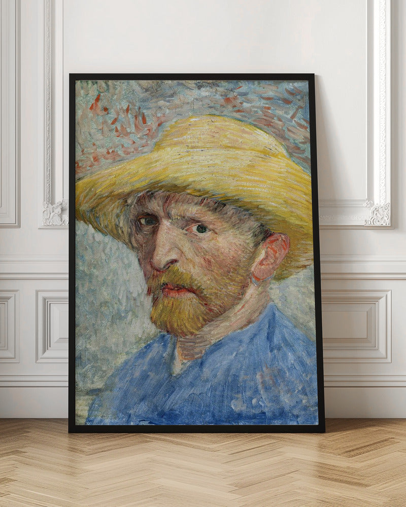 A framed Post-Impressionist self-portrait by Vincent van Gogh. The artist is depicted from the chest up, wearing a vibrant yellow straw hat and a blue smock. He has a reddish-blond beard and an intense, direct gaze. The background is a mix of light blue, white, and red-orange brushstrokes. Artwork