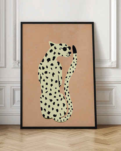 A minimalist illustration of a seated leopard against a solid peach-colored background, enclosed in a black frame. The leopard is cream-colored with black spots, wearing round black sunglasses, and has a slight smile. Poster