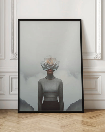A surrealist portrait of a person from the waist up, their face completely covered by a large, white paper rose. They are wearing a grey turtleneck sweater and stand in front of a foggy, mountainous landscape under a pale grey sky. Poster