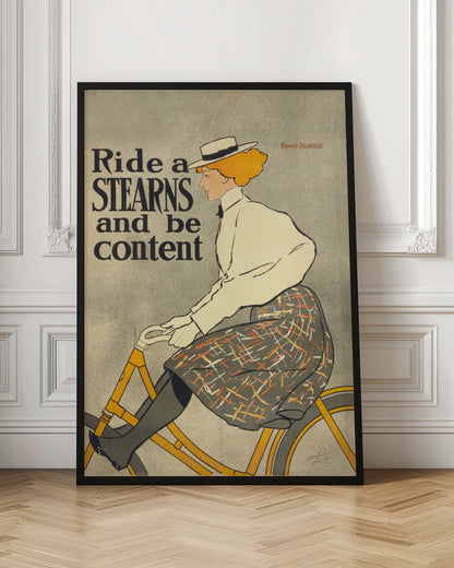A vintage advertisement poster by Edward Penfield for Stearns bicycles. The poster features a woman with orange-blonde hair and a white hat riding a yellow bicycle. The text on the left says 'Ride a STEARNS and be content'. Decor