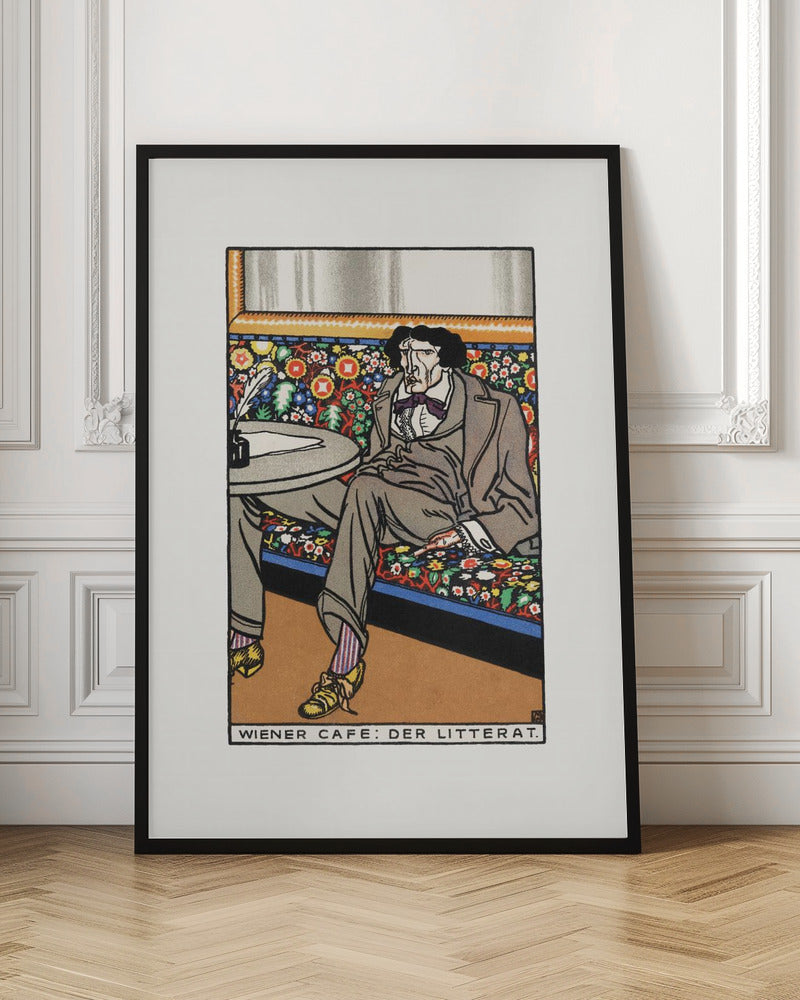 A framed art print titled 'Wiener Cafe: Der Litterat', depicting a stylized illustration of a writer in a Viennese cafe. The man, with a gaunt face and dark hair, sits on a brightly colored, floral-patterned bench, wearing a grey suit, striped socks, and yellow shoes. A table beside him holds an inkwell and quill. Decor