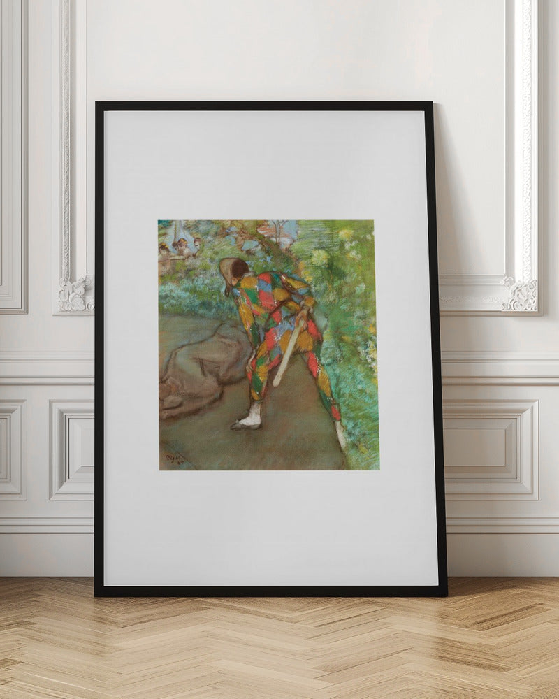A framed vintage painting by Edgar Degas depicting a Harlequin in a colorful diamond-patterned costume. The figure is shown from the back, bending in a garden setting, with other figures faintly visible in the background. Wall Art
