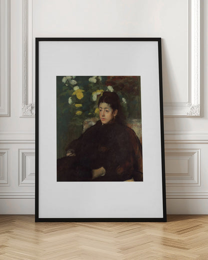 A framed impressionist portrait painting by Edgar Degas of a young woman with dark hair pulled back, wearing a voluminous dark dress. She sits in a chair with a pensive look, set against a background of yellow and white chrysanthemums and dark green foliage. Decor