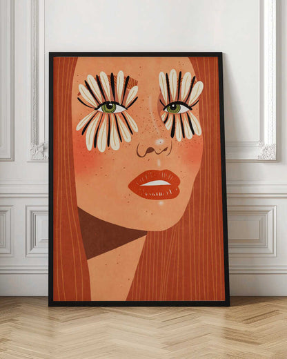 A stylized close-up illustration of a woman's face with long red hair, freckles, and green eyes. Her makeup is a bold, graphic design of black and white flower petals radiating around her eyes, and she has bright red lips. Decor