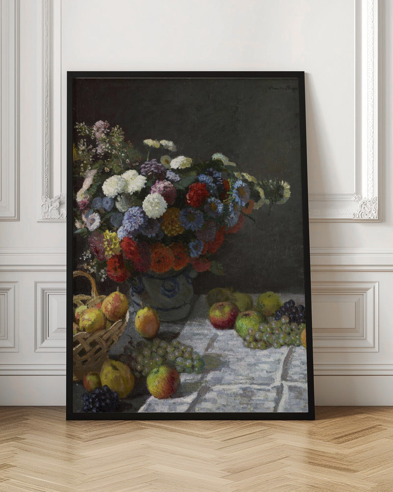 A classic still life painting by Claude Monet depicting a vibrant, multicolored bouquet of flowers in a ceramic vase. Scattered around the vase on a white tablecloth are various fruits, including apples, pears in a basket, and bunches of grapes, all set against a dark, moody background. Poster