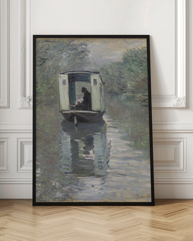 An Impressionist painting by Claude Monet titled 'The Studio Boat,' depicting a figure in a hat and dark coat sitting inside a small, white-paneled boat on a calm, grey-green river. The scene is enveloped in a soft, hazy light, with blurry trees lining the banks and a strong, rippling reflection of the boat in the water. Artwork