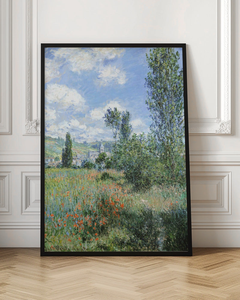 An impressionist painting depicting a vibrant green field filled with red poppies under a bright blue sky with fluffy white clouds. Tall green trees stand on the right, and in the distance, a small village with a church steeple is nestled in the rolling hills. Decor