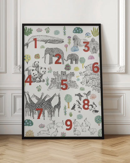 An educational art print in a black frame, featuring numbered groups of animals from one to nine. The illustrations are black and white drawings, with large red numbers indicating the count for each group: 1 whale, 2 elephants, 3 gorillas, 4 pandas, 5 tigers, 6 rhinos, 7 giraffes, 8 puffins, and 9 rabbits, interspersed with colorful plants on a cream background. Print