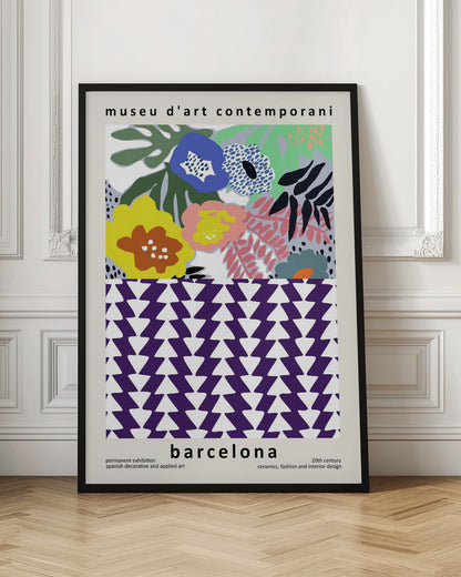 A contemporary art museum poster for Barcelona, featuring a split design. The top half shows a colorful abstract floral pattern with blue, yellow, pink, and green flowers. The bottom half displays a striking geometric pattern of purple and white interlocking triangles. The poster is framed in black. Print