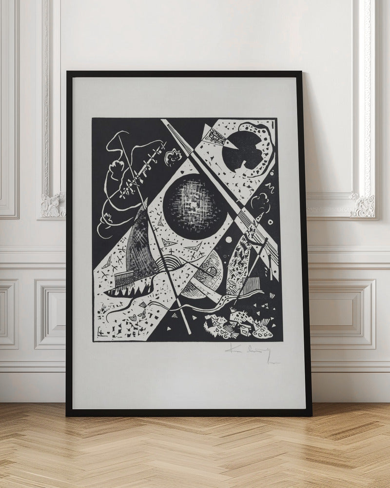 A framed black and white abstract woodcut print by Wassily Kandinsky. The dynamic composition features a mix of geometric shapes like circles and triangles, intersected by strong diagonal lines. Various textures and patterns fill the space, creating a sense of depth and movement. The artist's signature is visible in pencil on the white mat in the bottom right corner. Print