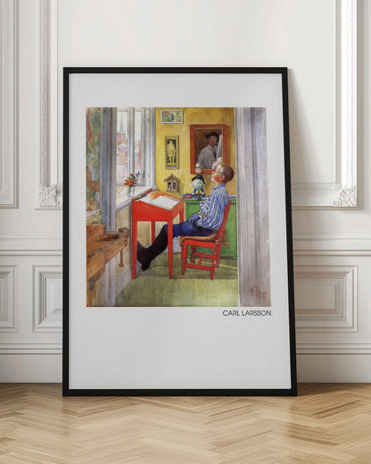 A framed art print of a Carl Larsson painting from 1912. It shows a young boy in a blue and white striped shirt sitting at a red desk in a sunlit, yellow-walled room. He is leaning back in his chair and looking up, as if daydreaming. Through the window, a cityscape with a church steeple is visible. The room is filled with charming details like framed pictures, a small globe, and a wooden workbench. Artwork