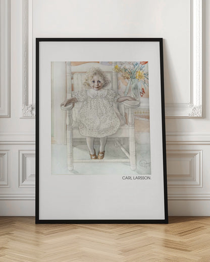 A framed art print of a watercolor painting by Carl Larsson. The piece features a young, blonde, curly-haired girl with blue eyes sitting in a white wooden chair. She wears a white dotted dress with a lace collar and smiles sweetly. Next to her is a vase of yellow, white, and red flowers. The overall aesthetic is soft, light, and classic. Decor