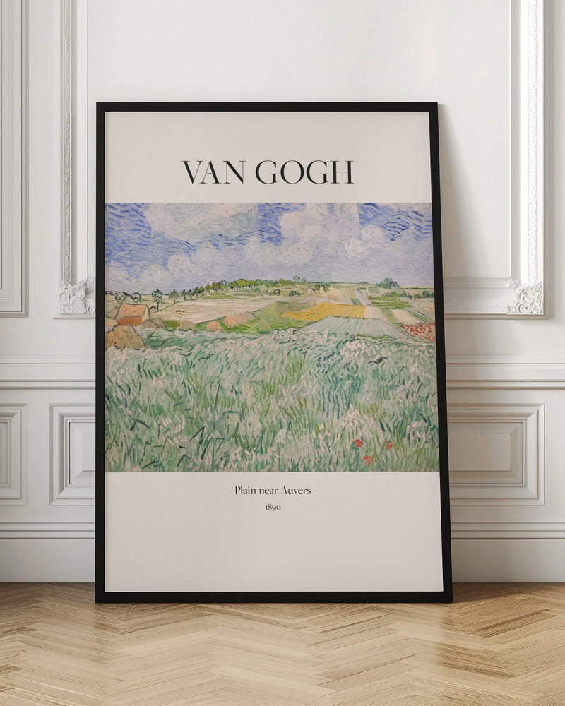 A framed art poster of Vincent van Gogh's painting, 'Plain near Auvers' from 1890. The impressionist landscape shows a vast green field in the foreground, with patchwork fields in the distance under a blue and white cloudy sky. The artist's name is printed in black serif font at the top, with the title and year at the bottom, all on a cream-colored background. Wall Art