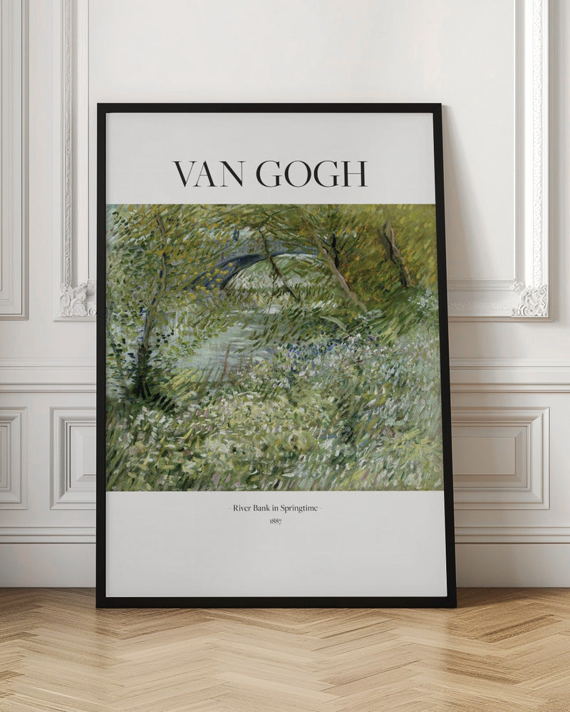 A framed poster of Vincent van Gogh's painting, 'River Bank in Springtime'. The impressionist artwork depicts a lush green landscape with a river and a stone bridge, painted with visible, textured brushstrokes. The title and artist's name are printed on a white border. Artwork